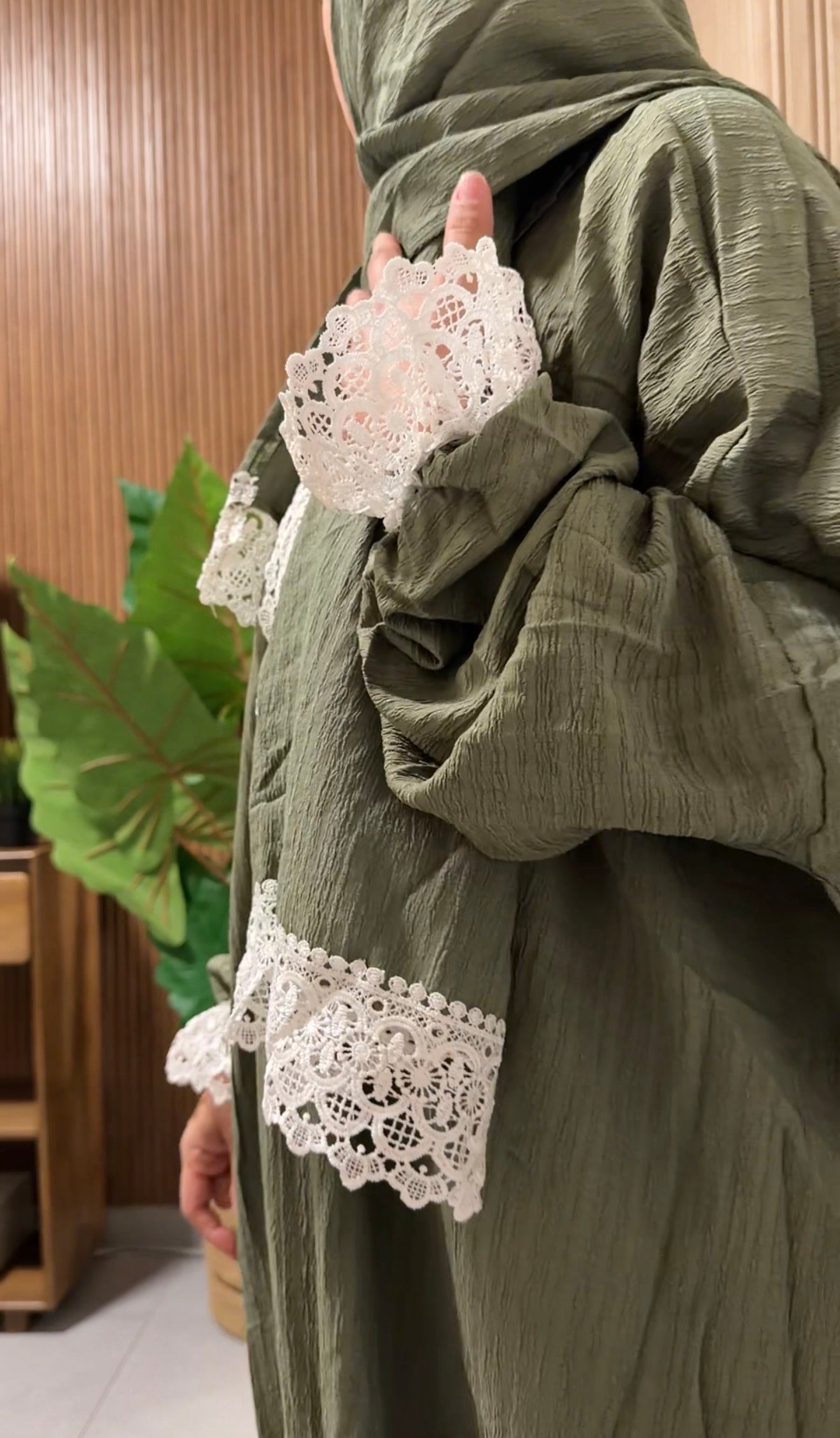 Green burqa with white lace
