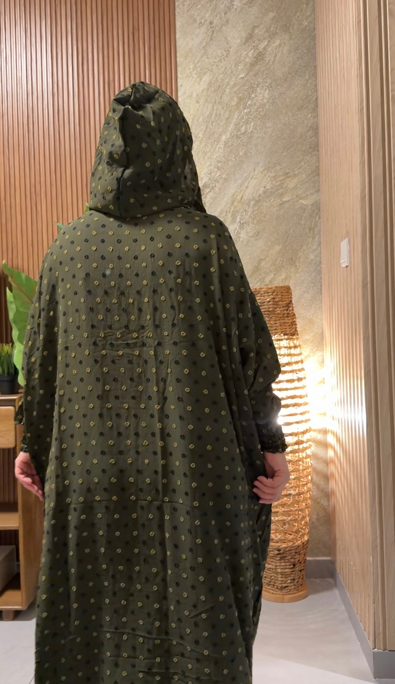 Green burqa with black dots