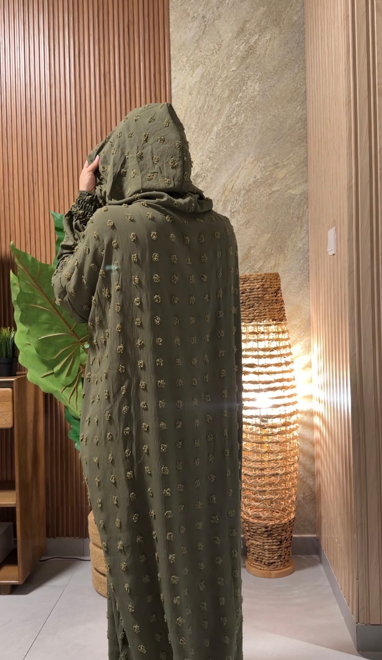Army green burqa with big dots.
