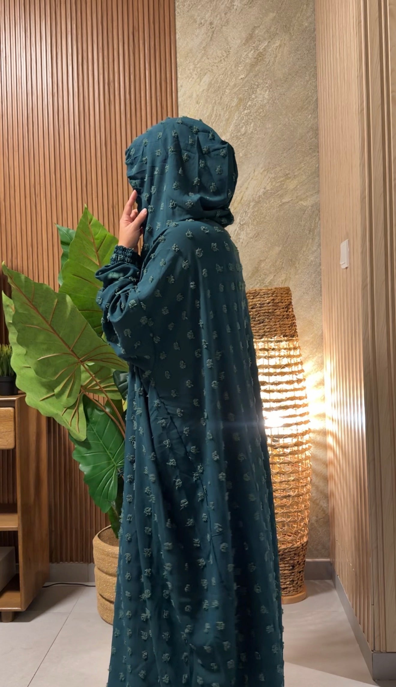 Dark green burqa with big dots.