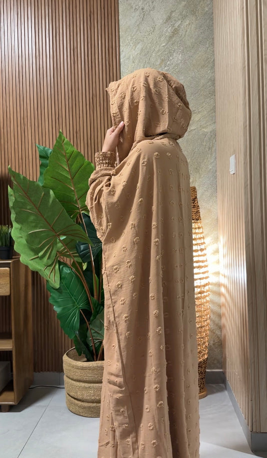 Beige burqa with big dots.