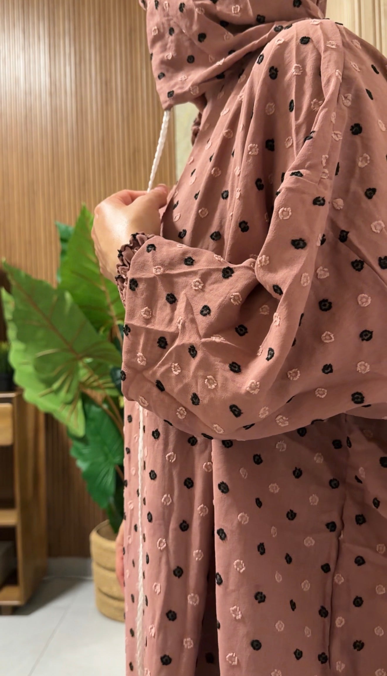 Pink burqa with black dots