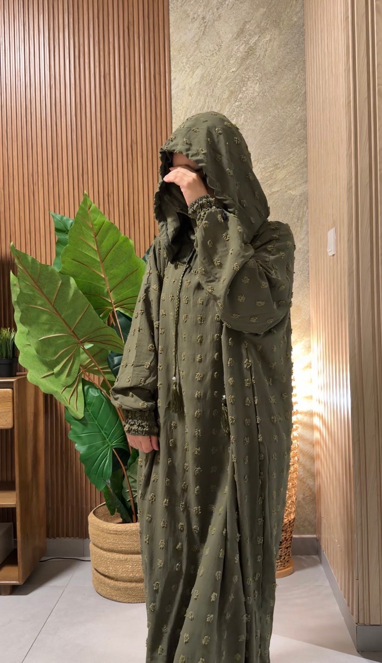Army green burqa with big dots.