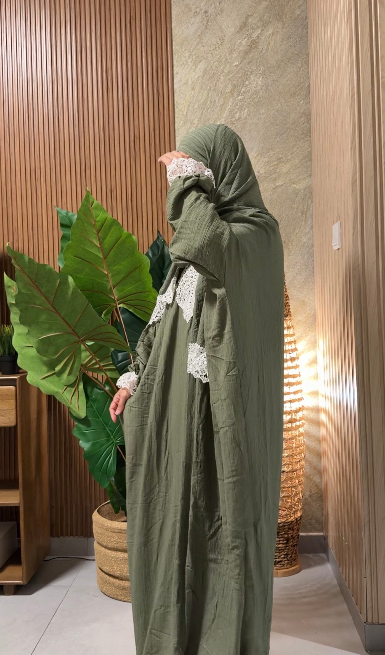 Green burqa with white lace