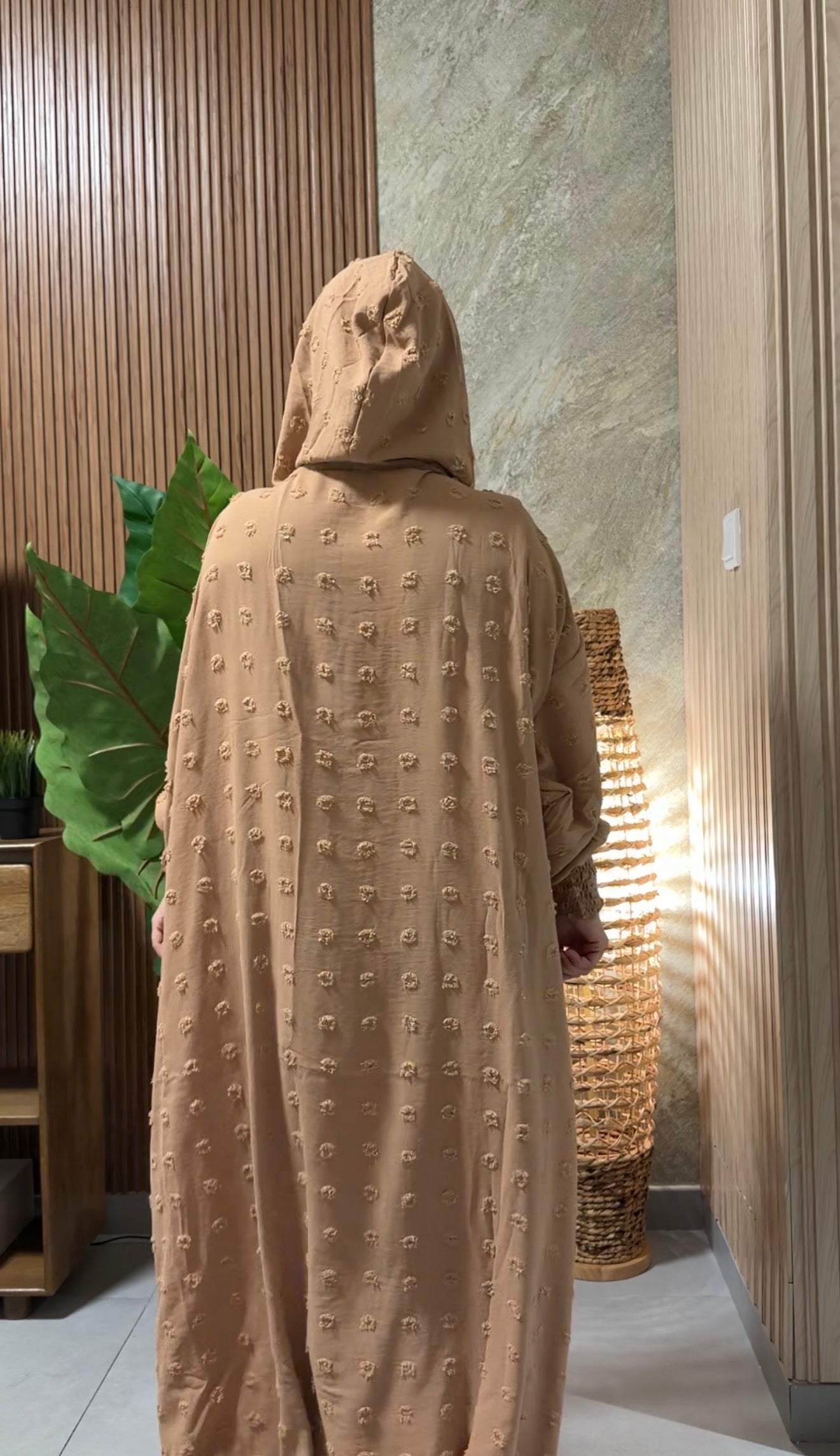 Beige burqa with big dots.