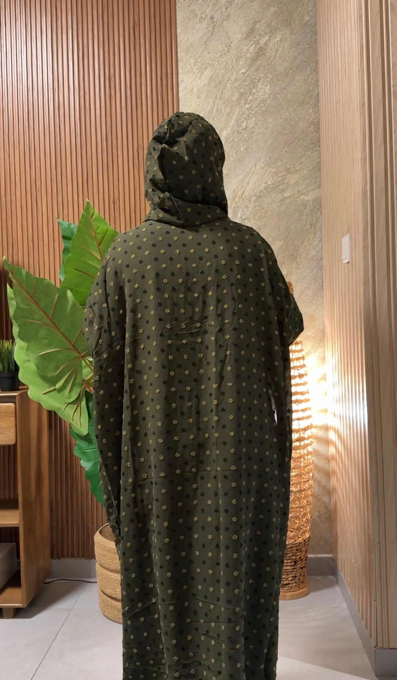 Green burqa with black dots