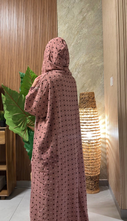 Pink burqa with black dots