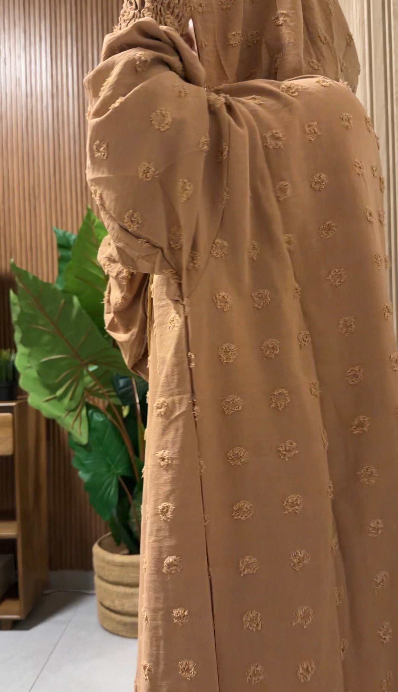 Beige burqa with big dots.