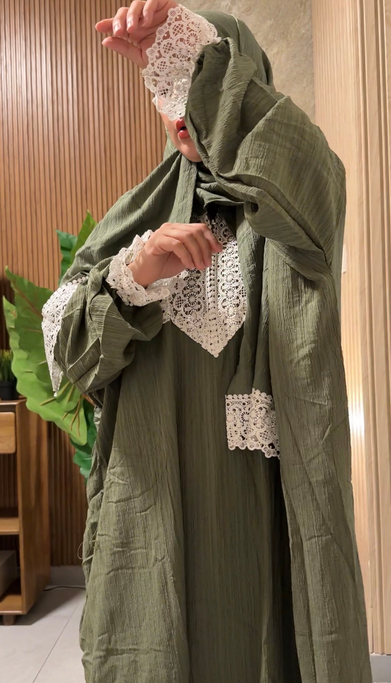 Green burqa with white lace