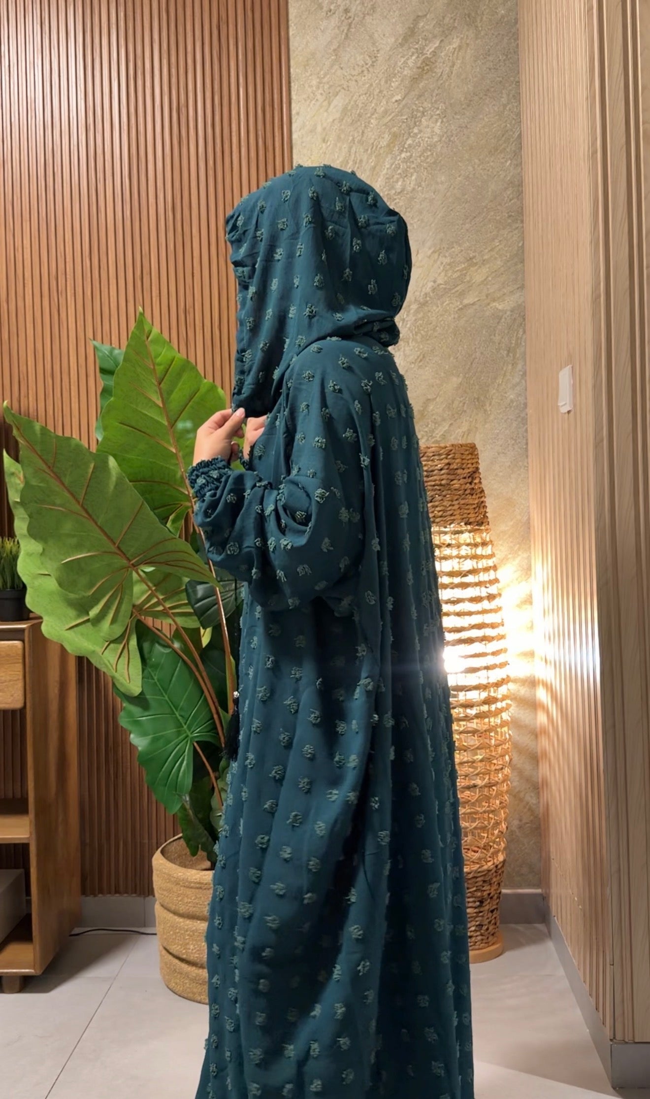 Dark green burqa with big dots.