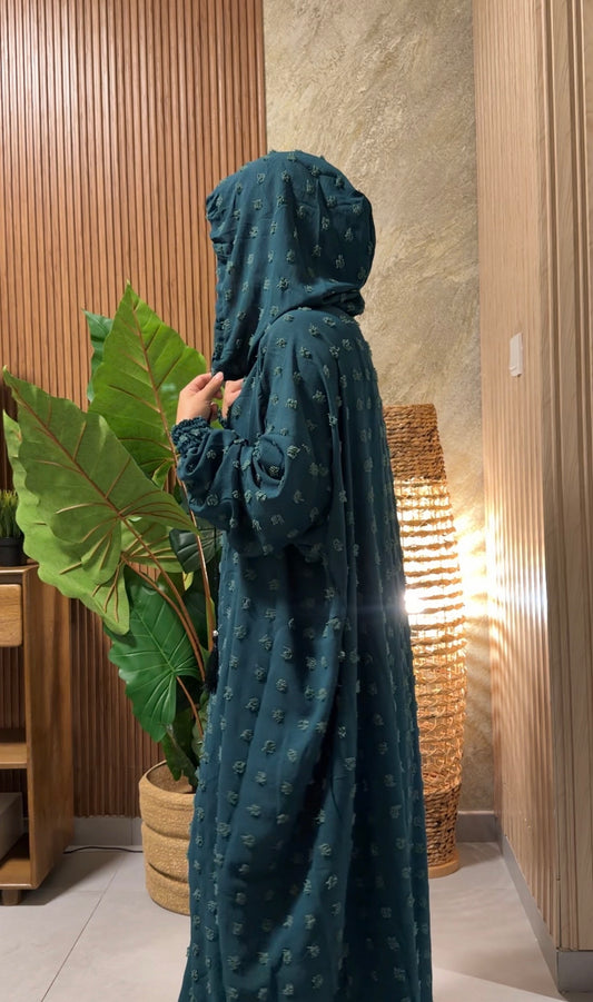 Dark green burqa with big dots.