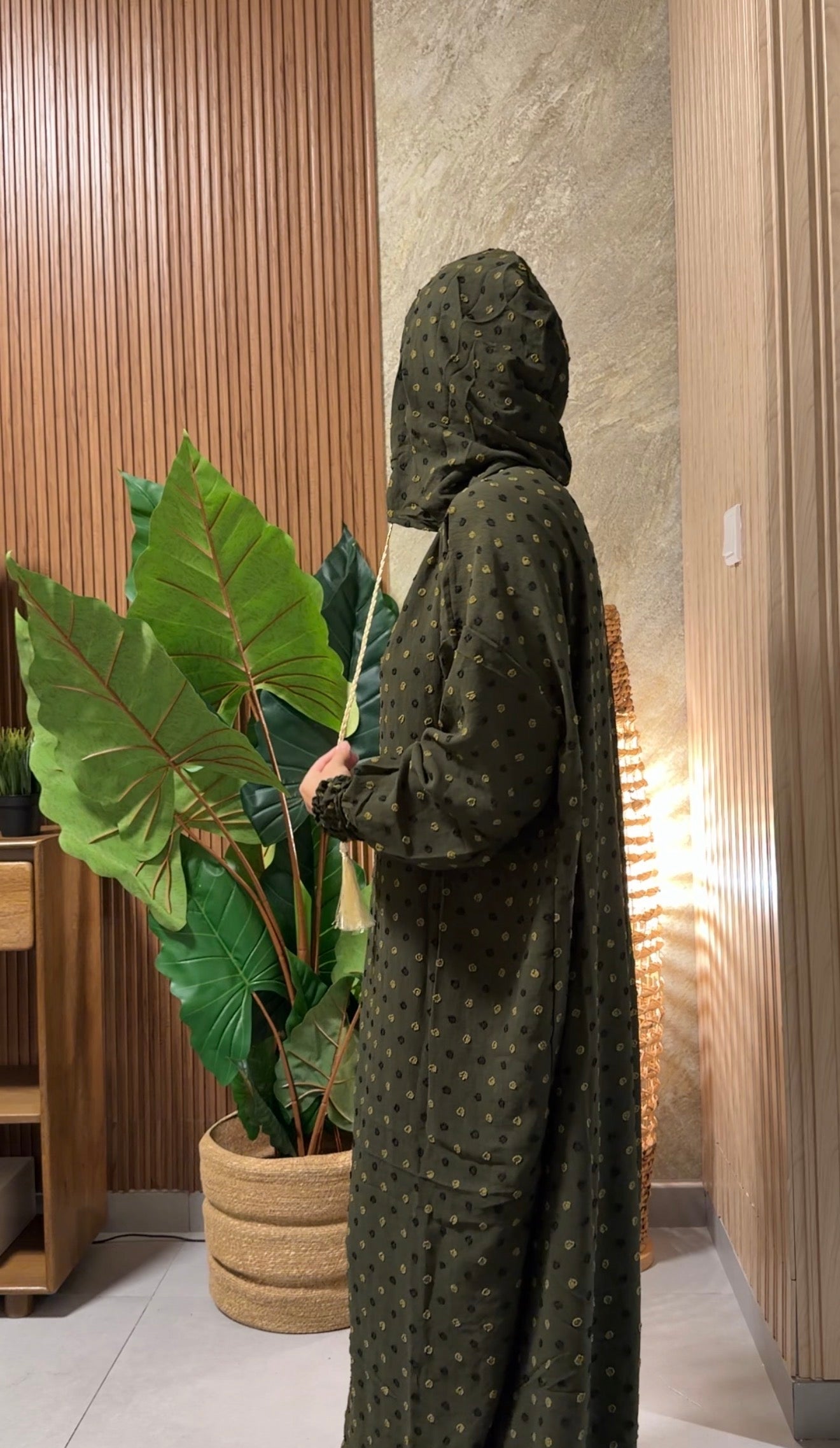 Green burqa with black dots